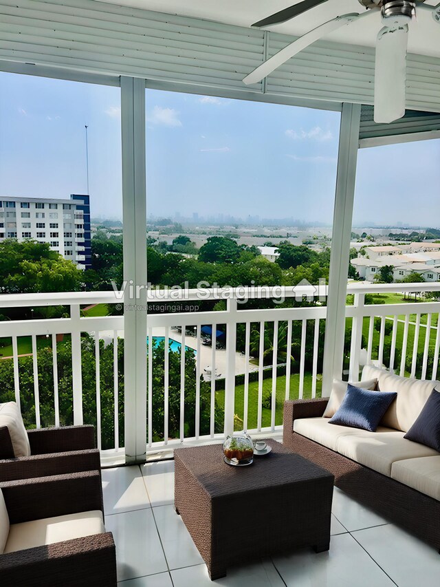 balcony with an outdoor living space and ceiling fan