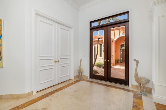 doorway with french doors and ornamental molding