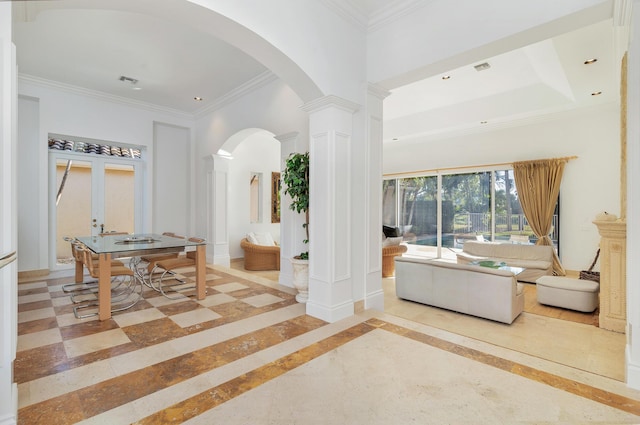 interior space with ornate columns, ornamental molding, and recessed lighting