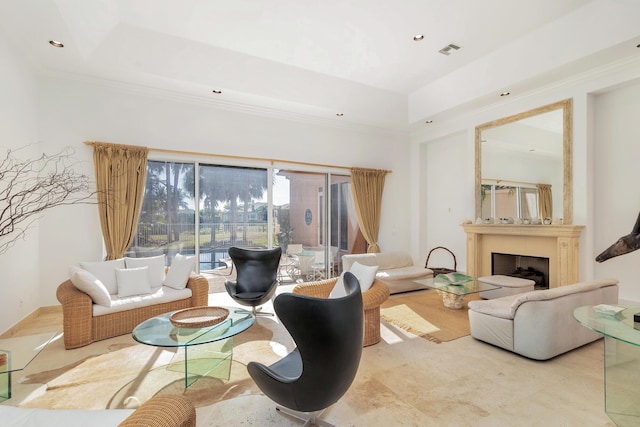 living area featuring a fireplace, visible vents, crown molding, and recessed lighting