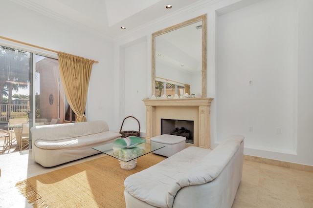 living area with crown molding, a fireplace, recessed lighting, a high ceiling, and baseboards