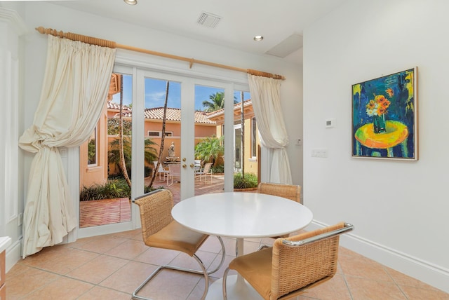 dining area with french doors, light tile patterned floors, recessed lighting, visible vents, and baseboards