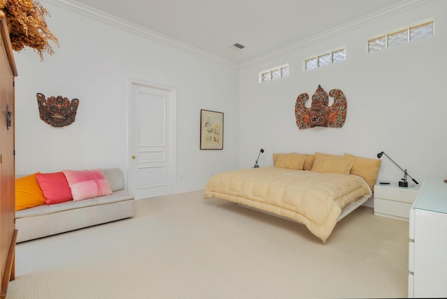 bedroom with light carpet and crown molding