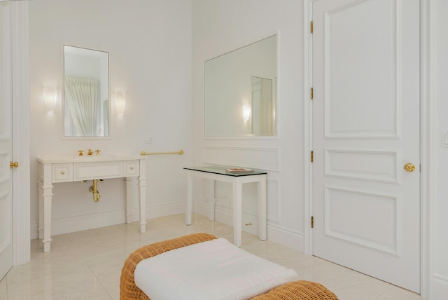 bathroom featuring baseboards and tile patterned floors