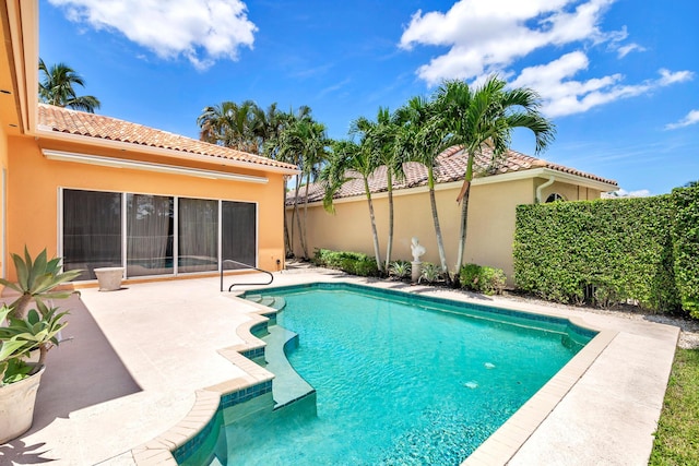 view of swimming pool featuring a fenced in pool and a patio