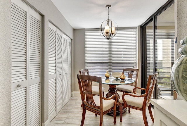 tiled dining room featuring an inviting chandelier