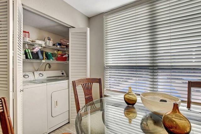 clothes washing area featuring separate washer and dryer