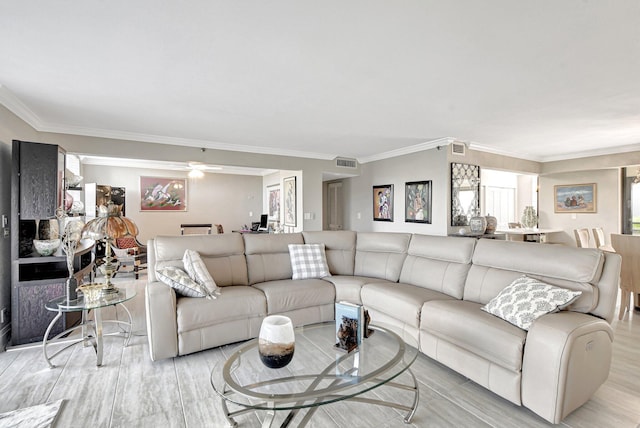 living room with ceiling fan, ornamental molding, and light hardwood / wood-style floors