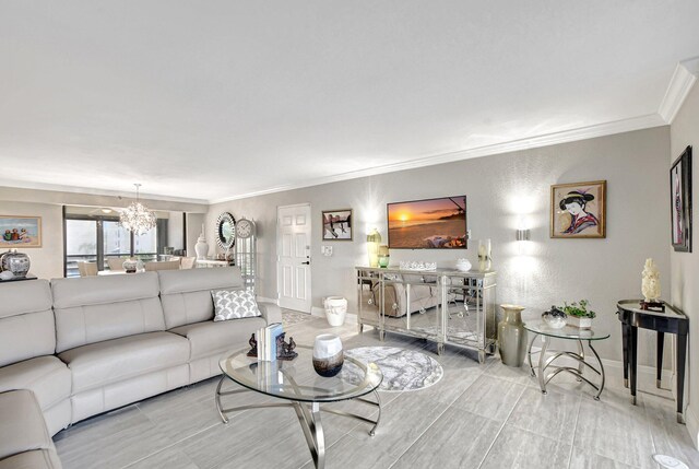 living room with crown molding and a chandelier