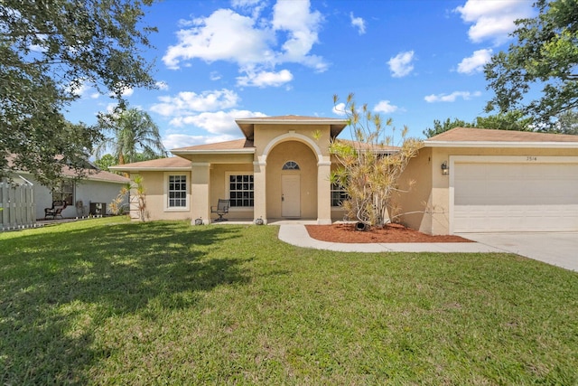 view of front of house featuring a garage and a front yard