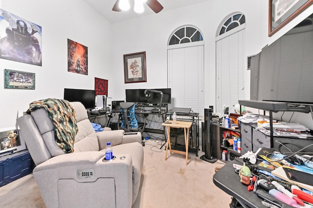 office area featuring ceiling fan and light carpet