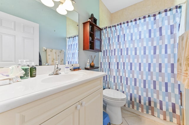 bathroom with walk in shower, tile patterned flooring, vanity, and toilet