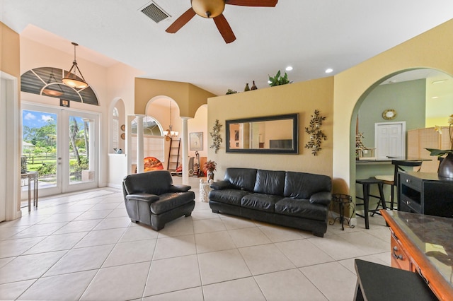 living room with ceiling fan, french doors, and light tile patterned flooring