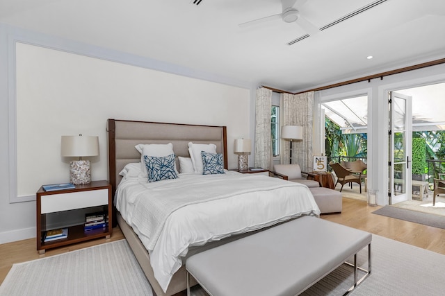 bedroom with ceiling fan, wood-type flooring, and access to outside