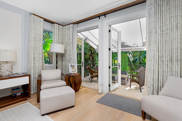 sitting room with light hardwood / wood-style flooring