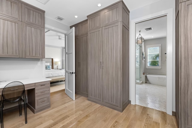 office area with light hardwood / wood-style floors