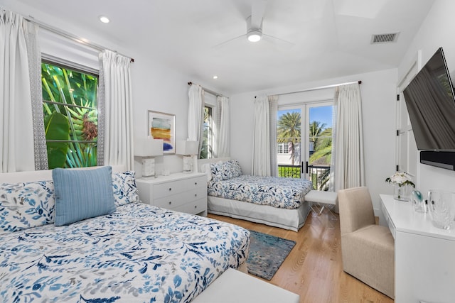 bedroom featuring access to exterior, ceiling fan, and light wood-type flooring