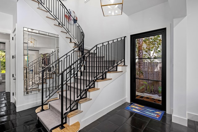 entrance foyer with plenty of natural light and a chandelier