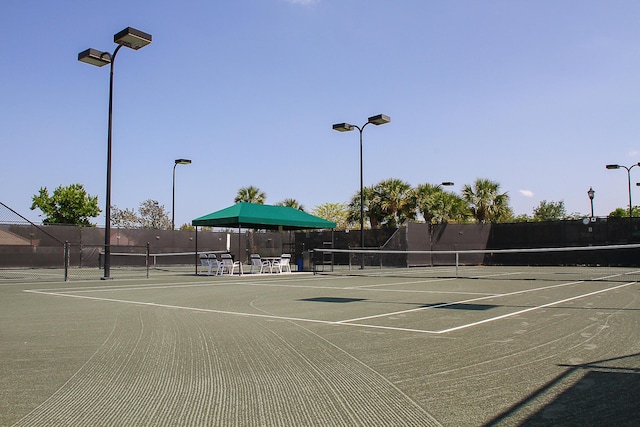 view of tennis court with basketball court