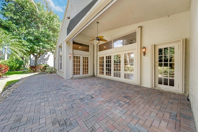 view of patio / terrace featuring ceiling fan and french doors