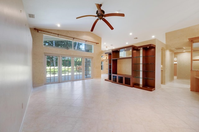 unfurnished living room with ceiling fan, light tile patterned flooring, lofted ceiling, and french doors