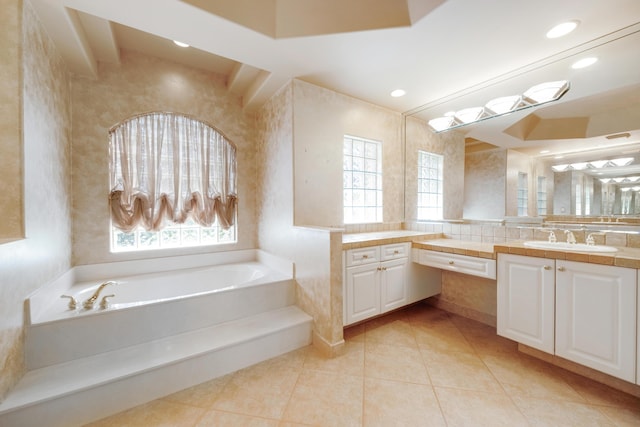 bathroom with vanity, tile patterned floors, and a tub