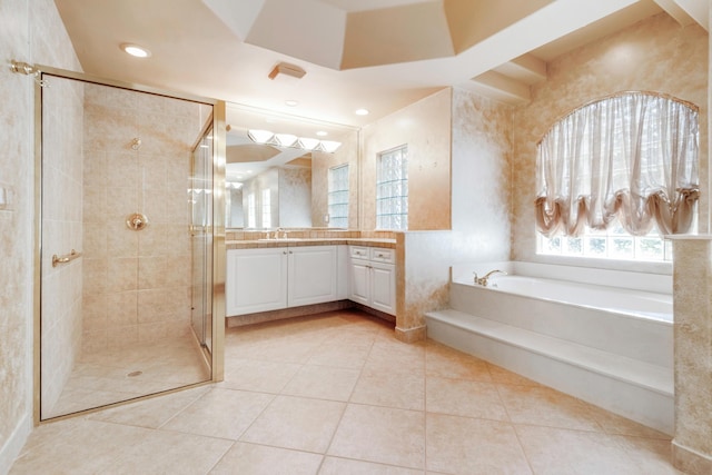 bathroom with plus walk in shower, vanity, and tile patterned floors