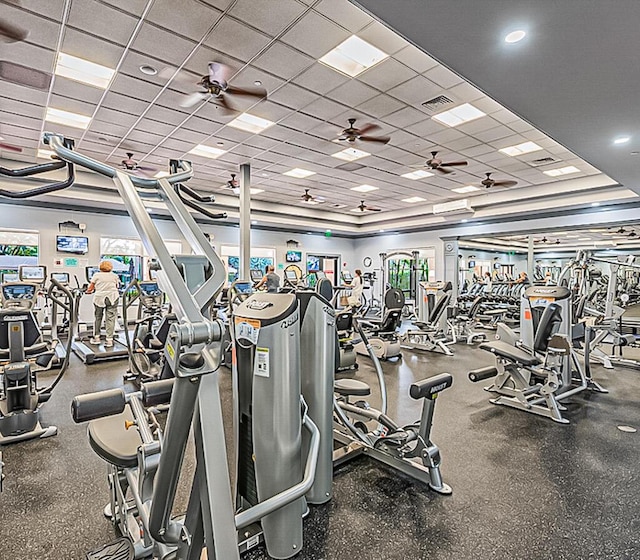 exercise room featuring a drop ceiling and ceiling fan