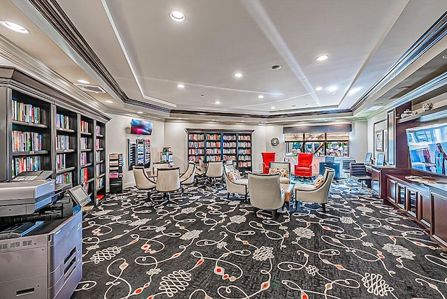 interior space featuring carpet floors, a tray ceiling, and crown molding