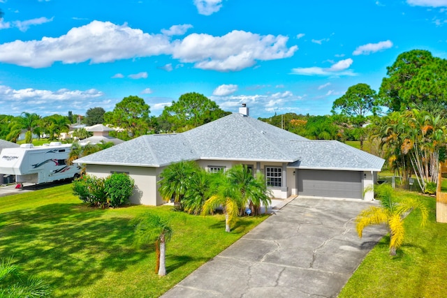 ranch-style house featuring a garage and a front lawn