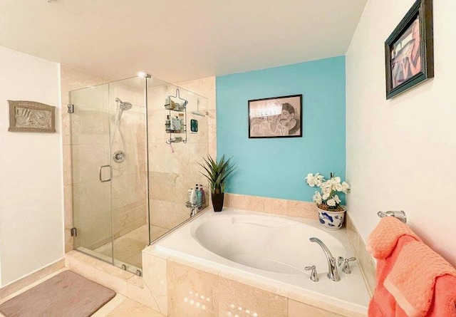 bathroom with shower with separate bathtub