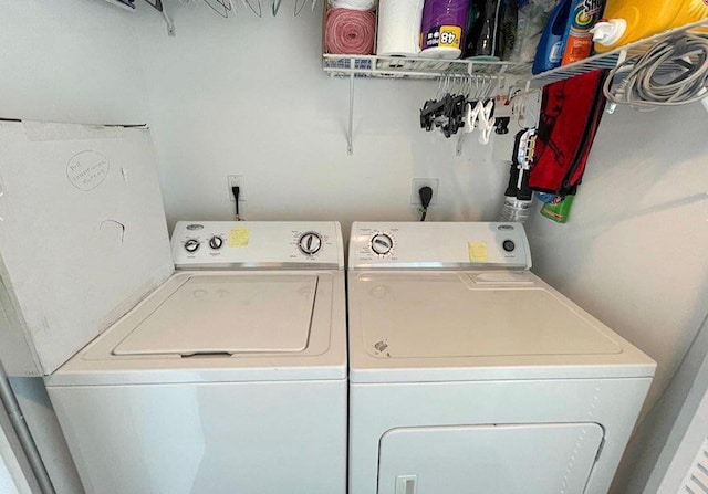 washroom with independent washer and dryer