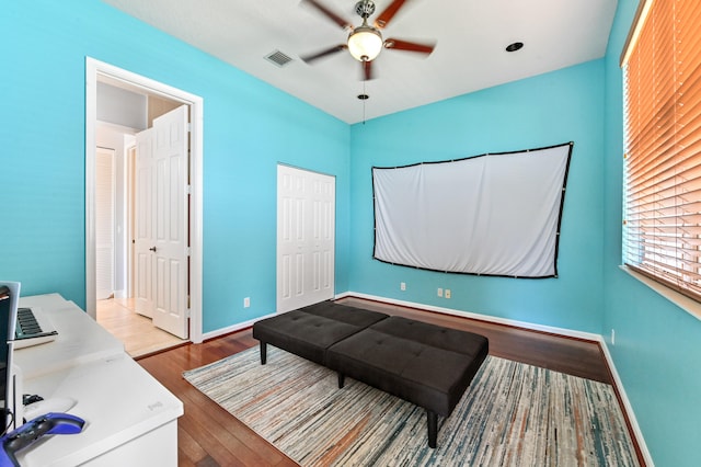 home office featuring light hardwood / wood-style floors and ceiling fan