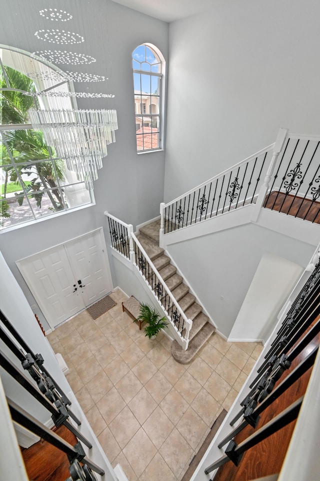 staircase with tile patterned floors