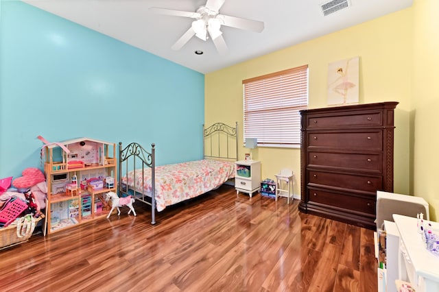 bedroom featuring ceiling fan and dark hardwood / wood-style floors