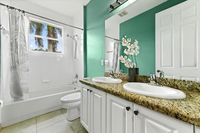 full bathroom featuring shower / tub combo with curtain, vanity, toilet, and tile patterned flooring