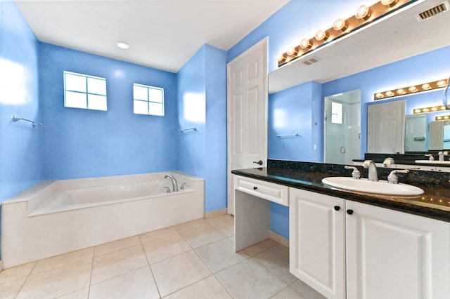 bathroom with vanity, tile patterned floors, and separate shower and tub