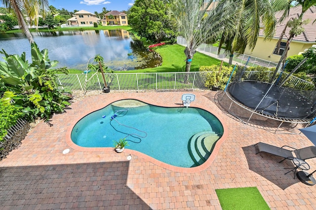 view of swimming pool featuring a hot tub, a water view, and a patio area