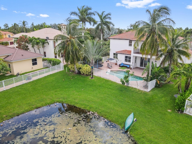 view of yard with a fenced in pool and a patio