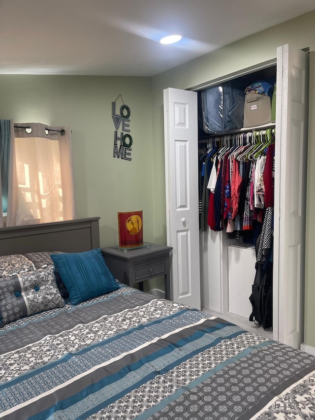 carpeted bedroom featuring a closet