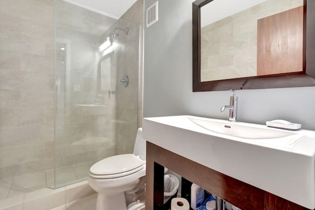 bathroom featuring vanity, toilet, and an enclosed shower