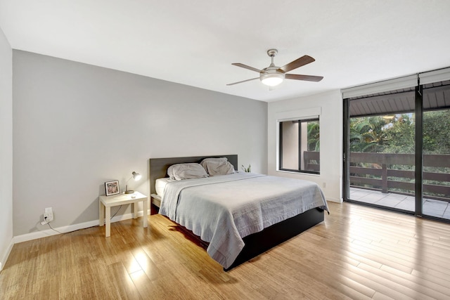 bedroom with access to outside, light wood-type flooring, and ceiling fan