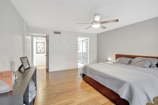 bedroom featuring ceiling fan, a closet, and light hardwood / wood-style flooring