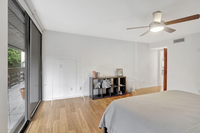 bedroom with ceiling fan and light wood-type flooring