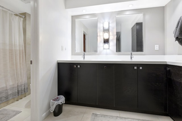 bathroom with vanity, tile patterned flooring, and curtained shower