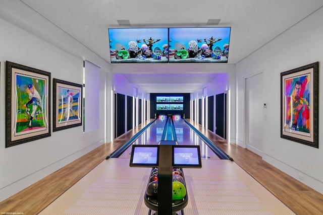 playroom featuring bowling and hardwood / wood-style flooring