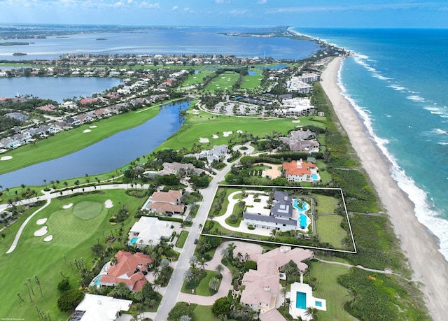 aerial view with a view of the beach and a water view