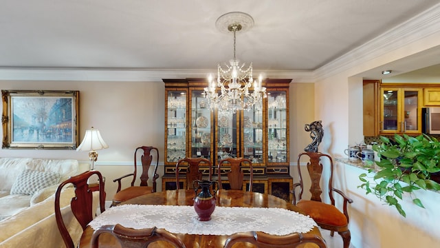 dining area featuring a notable chandelier and ornamental molding