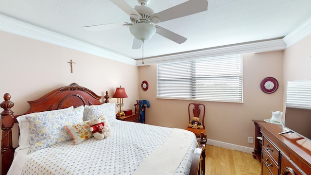 bedroom with ceiling fan, light hardwood / wood-style flooring, and ornamental molding