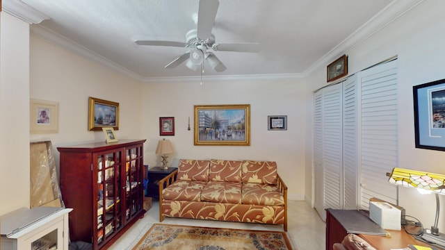 living room featuring ceiling fan, light carpet, and ornamental molding